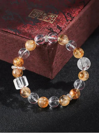 Women's crystal beaded bracelet handmade from yellow freshwater pearls, citrine, lemon crystal, and white crystal stones with small Buddha charm for fashion and OL style jewellery