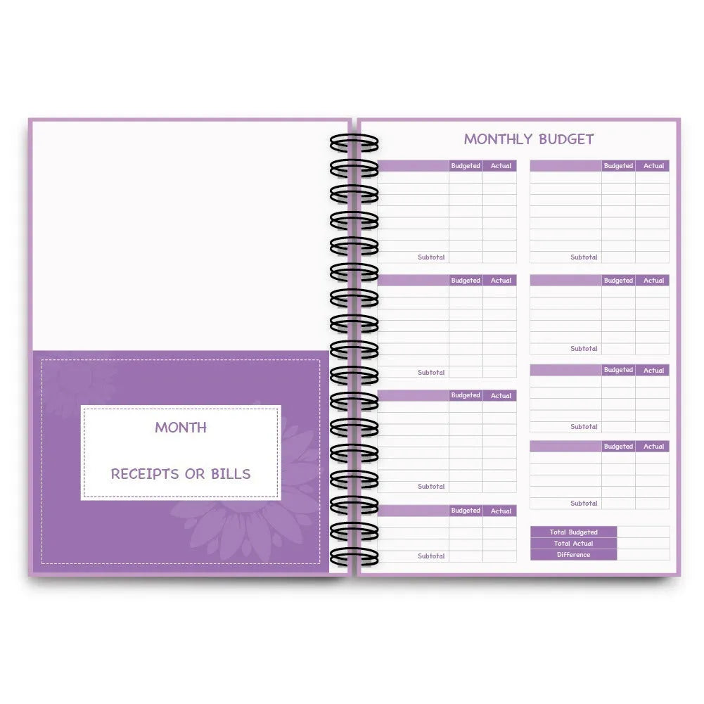 Purple coil-bound A5 budget notebook with pen, stickers and paper clips for financial planning