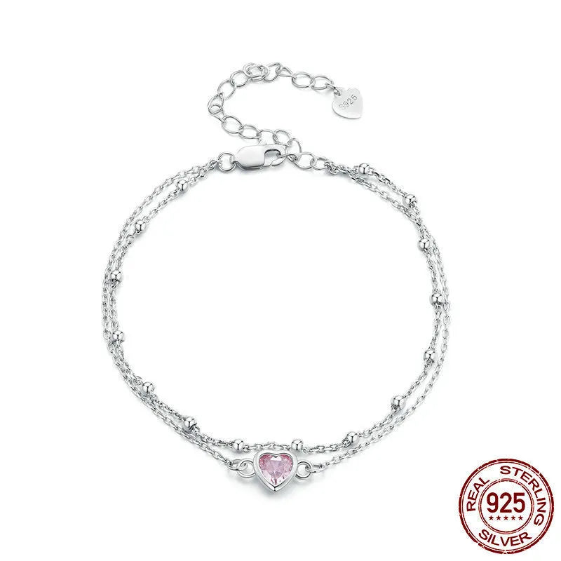 Sweet girlish sterling silver bracelet with a small heart charm on an adjustable chain.
