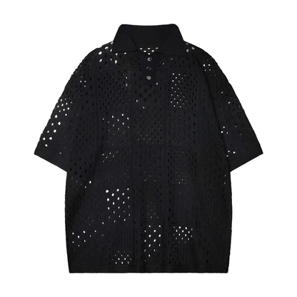 Teenager wearing a solid black loose-fit short-sleeved knit polo shirt.