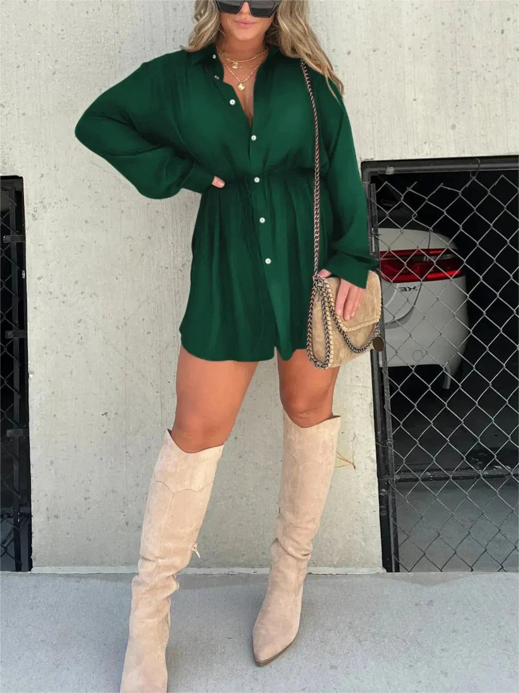 A stylish long sleeve jumpsuit with a button-up shirt design, available in a variety of vibrant colors.