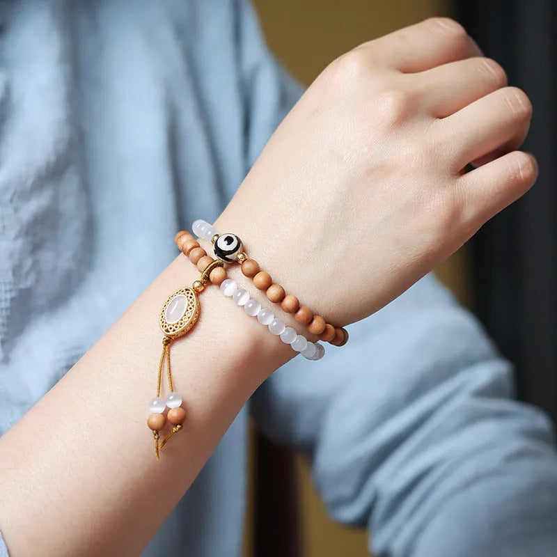 Sandalwood double ring and Opal Tibetan bead bracelet with polished finish