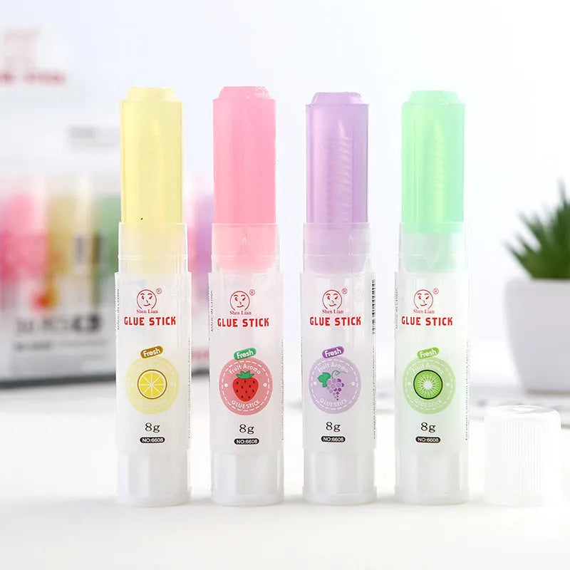 Jelly solid glue stick with fruit scent, 8.5 cm long, for student and craft use.