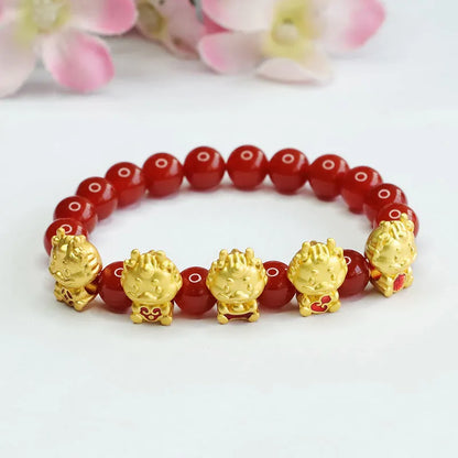 Red agate bracelet with carved five blessing dragon motifs on 8mm beads.
