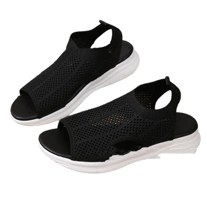 Women's black platform sports sandals with a flat toe and rubber sole on a light background