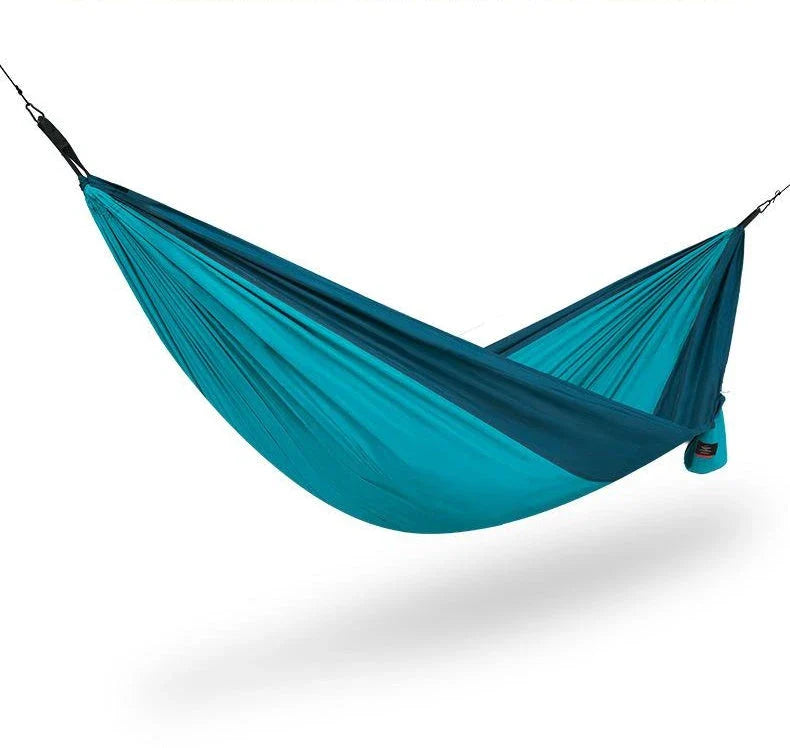 Premium double hammock made with soft, breathable fabric and reinforced ropes for outdoor use