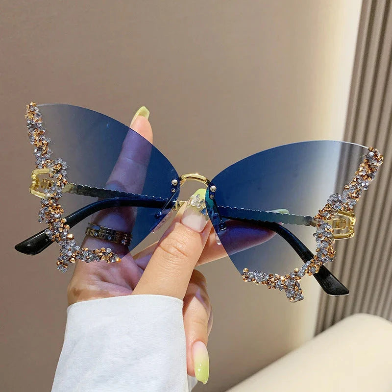 Chic butterfly-shaped sunglasses with diamond accents in various gradient color options