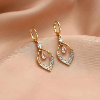 Women's copper teardrop tassel earrings with zircon detail and choice of gold or silver buckle.