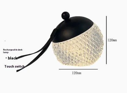 Small portable desk lamp with touch dimmer in gold finish, 12cm tall.