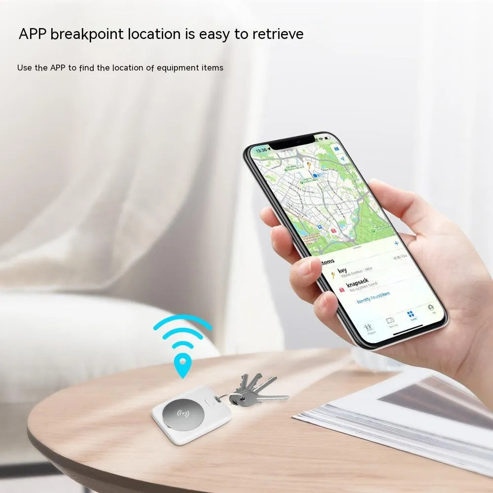 White ABS plastic pet GPS tracker with Apple device compatibility, showing compact design and collar attachment.