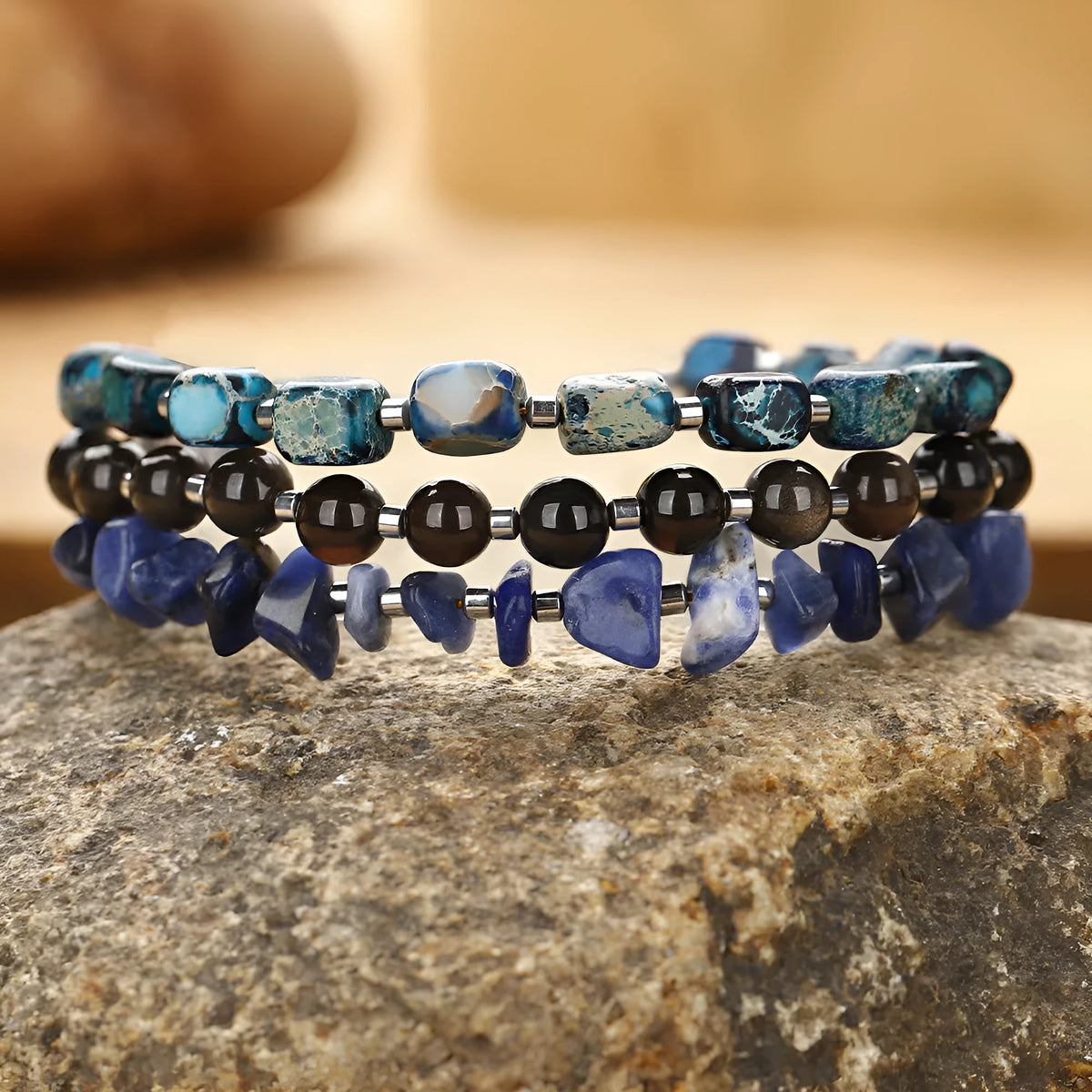 Hand-woven women's bracelet with crushed fang hui stone and gold obsidian geometric beads in multi-layer design