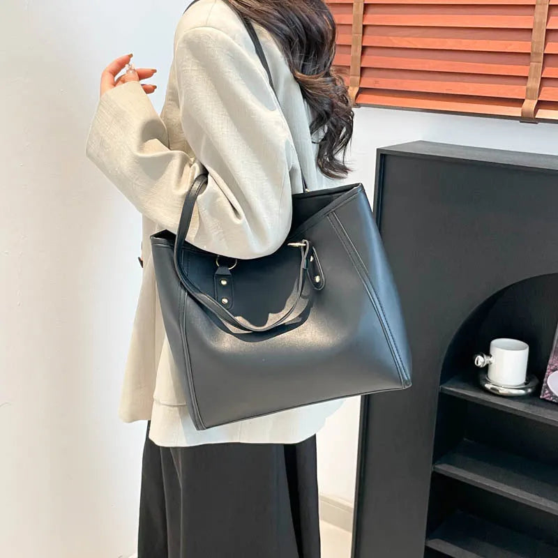 Korean style black PU leather shoulder underarm bag with a horizontal square shape and sandwich pocket.