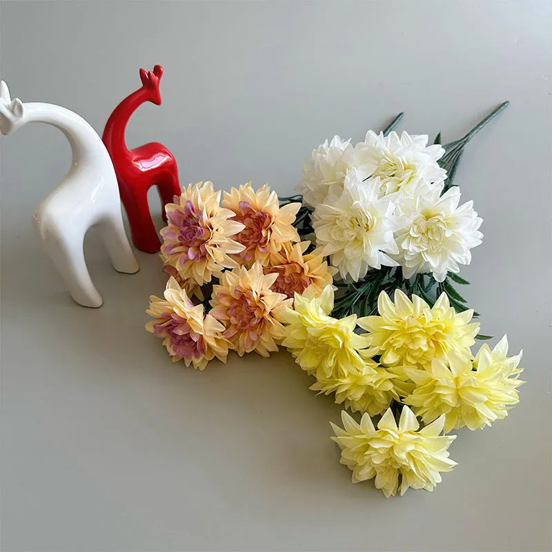 Desktop fan-shaped display holding artificial silk flowers in rose and peony varieties with colourful petals