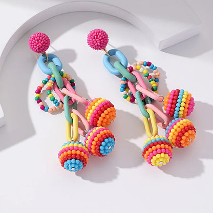 Handmade bohemian shell tassel earrings for women with colourful flower and geometric drop design