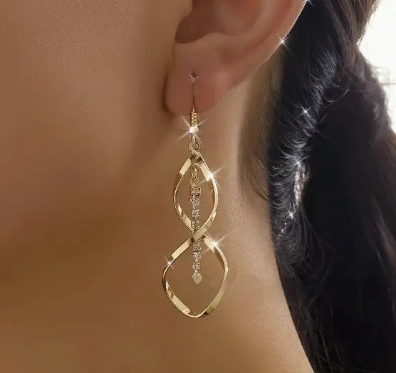Gold electroplated alloy spiral drop earrings with geometric elliptical design for women
