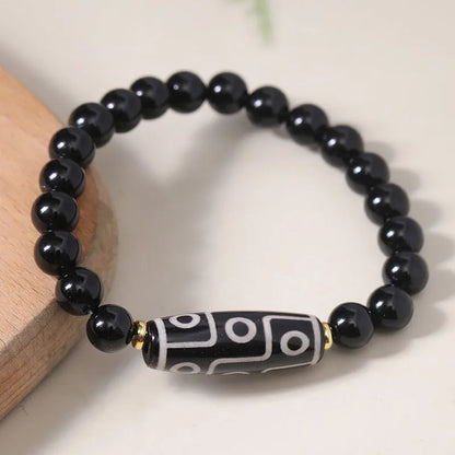 Obsidian-coloured agate Tibet dzi bead bracelet with traditional ethnic design