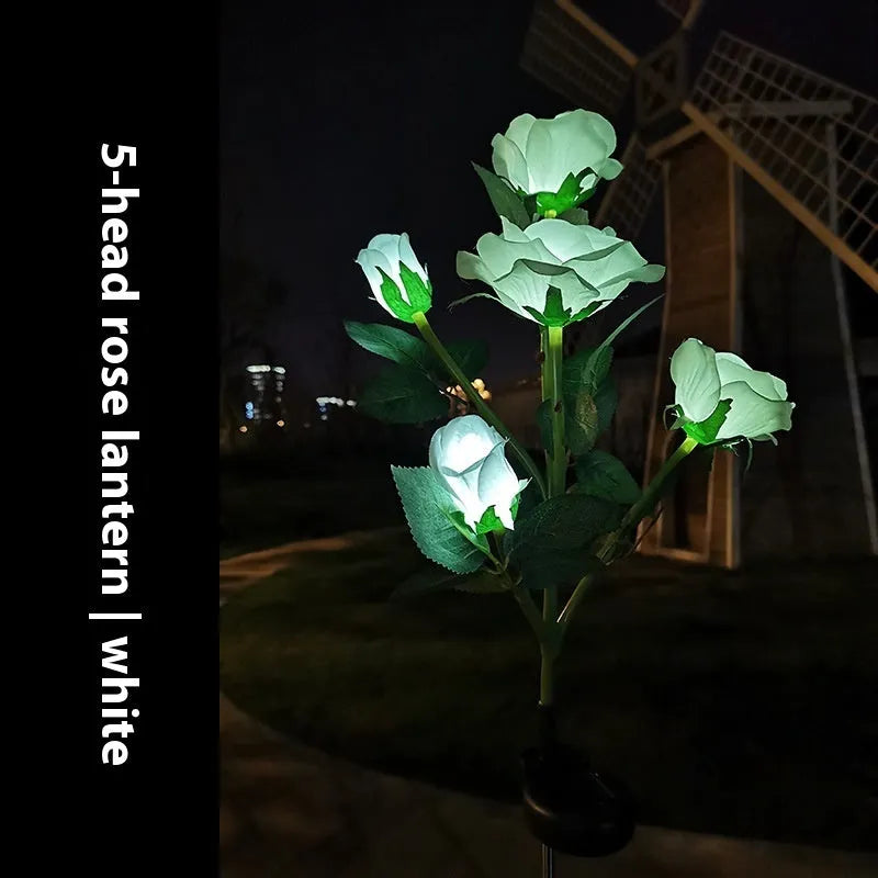 Colourful solar-powered LED lawn lamp in a flower shape for garden decoration.