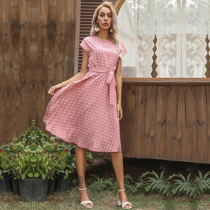 A classic polka dot midi dress with a buttoned style, perfect for summertime