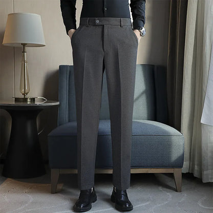Straight-leg brown corduroy trousers with elastic waistband on size chart