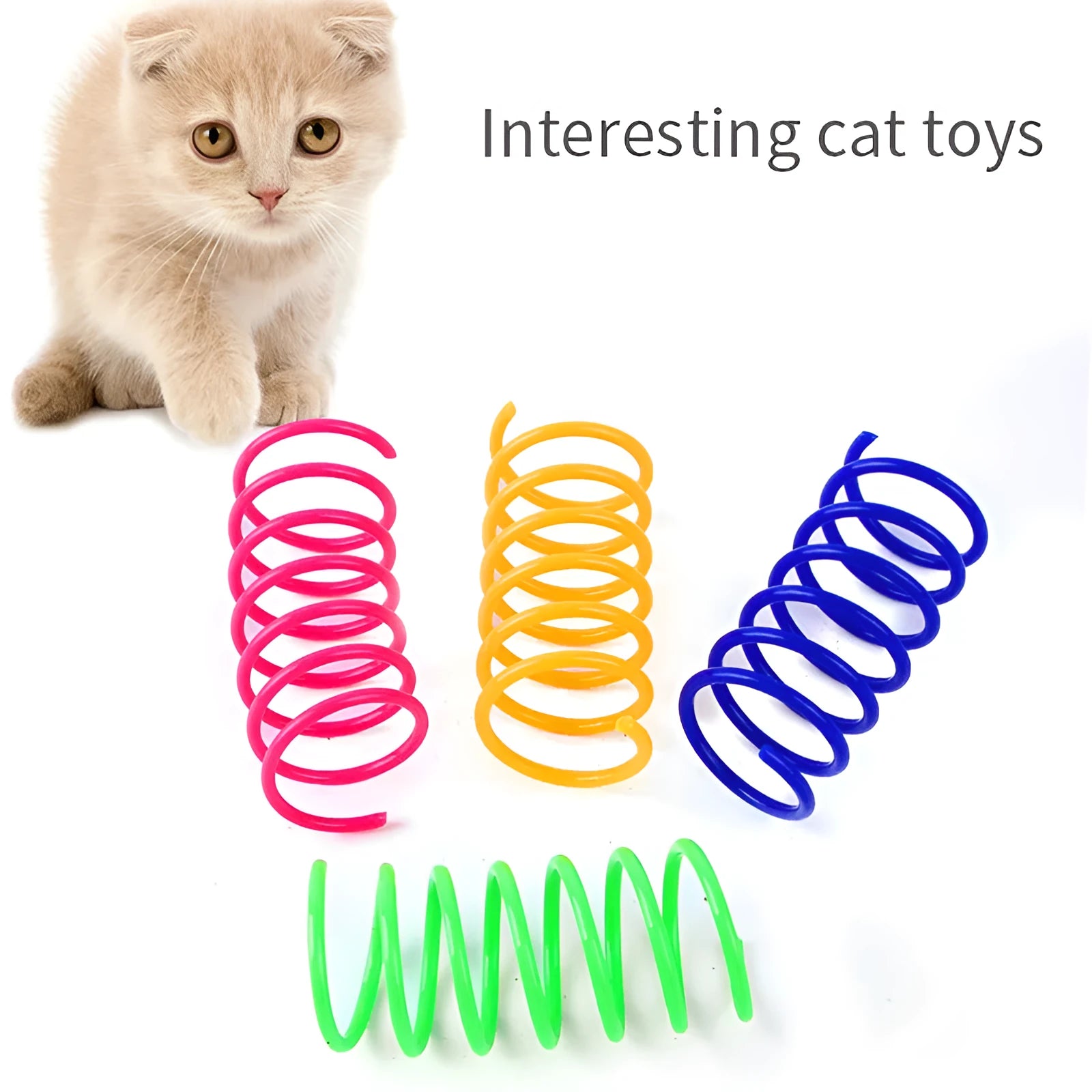 Assortment of colourful plastic coil spring toys for cats on a plain surface.