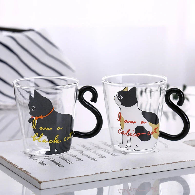 Adorable cat-themed glass mug with a whimsical cat-shaped handle, perfect for coffee, tea, and juice lovers