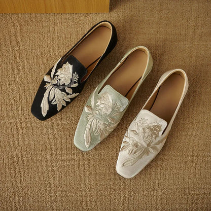 Women's embroidered low-cut flat pumps in beige with a round toe and soft sole.