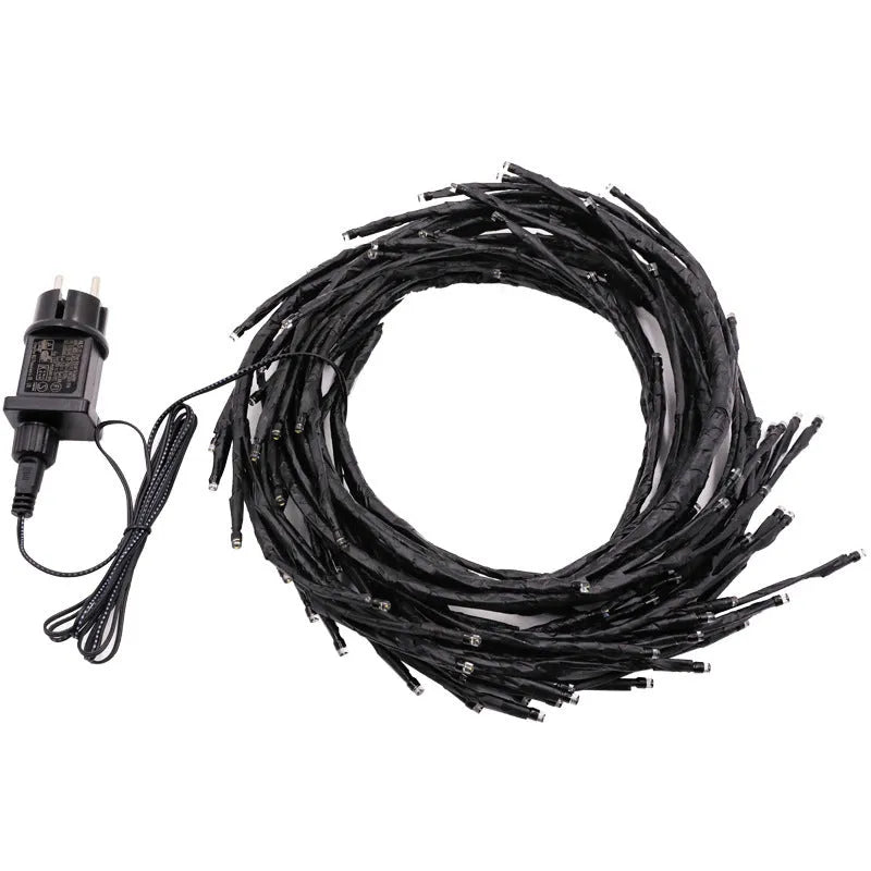 LED rattan tree light string arrangement with warm white illumination for decorative room lighting