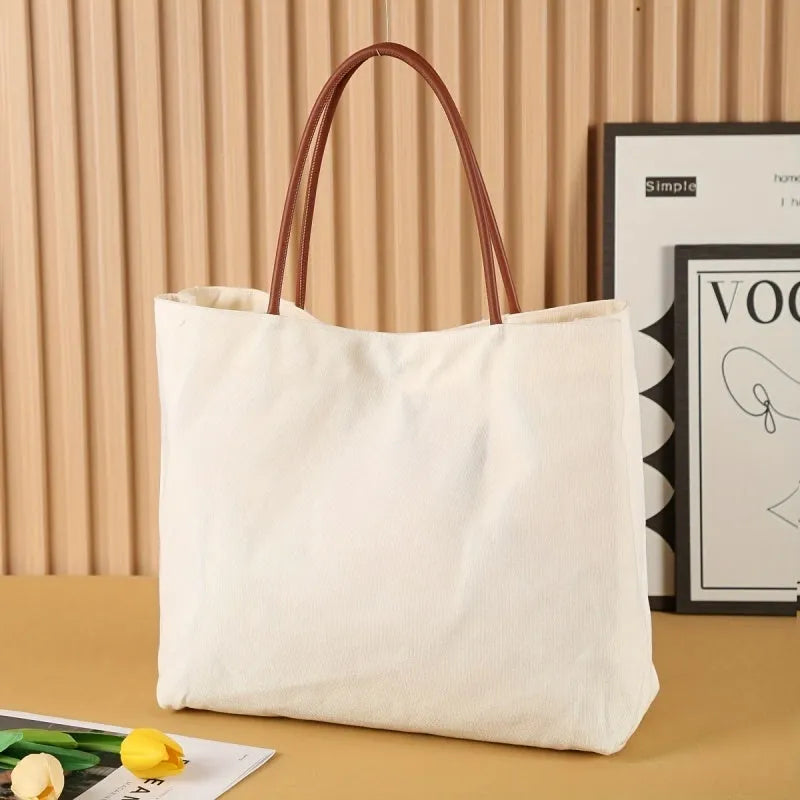 Cotton canvas tote bag shown in beige white and white colour options.