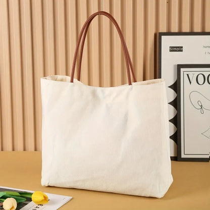 Cotton canvas tote bag shown in beige white and white colour options.