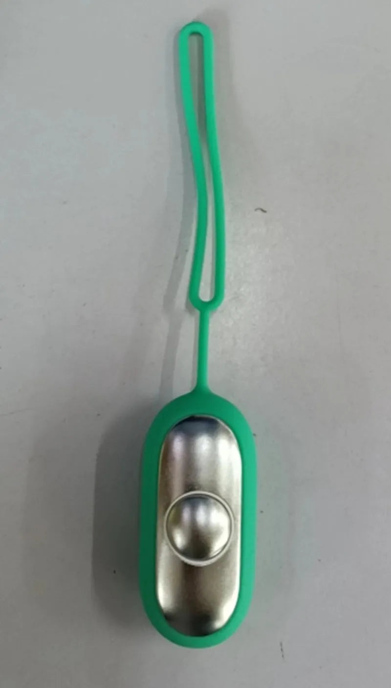 Hand-held micro-current sleep aid device in grey, green, or orange with round button and USB charging port