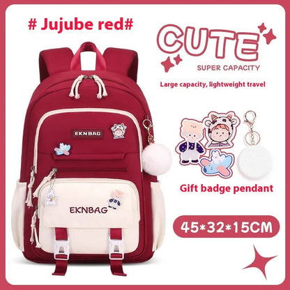 Pink girls school backpack with curved shoulder straps on a wooden floor