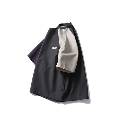 Dark grey men's loose fit t-shirt with contrasting colour raglan sleeves.
