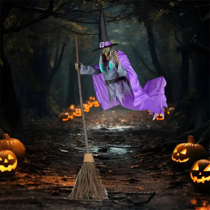 Floating witch Halloween decoration with broom, lifelike scary face, and purple hovering skirt