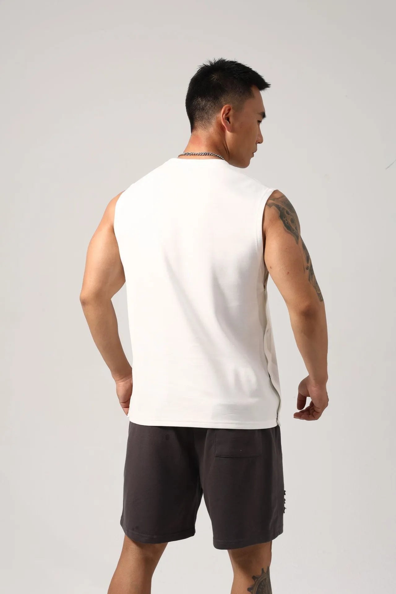 Korean style men's loose fitness vest with hidden hook design in solid colour