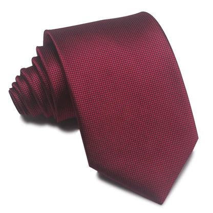 Close-up of a red and black striped men's business tie with a textured Jacquard weave, showing the 8cm width and arrow point shape.
