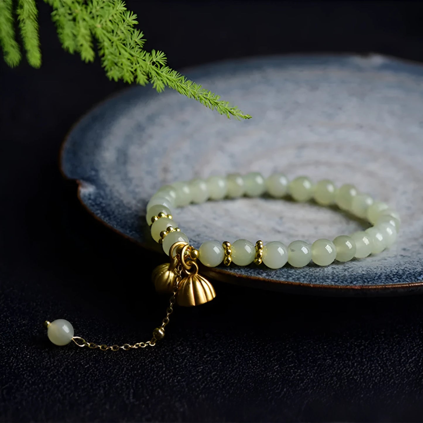 Natural Hetian jade bracelet with 6mm beads, engraved fu character, and constellation design on a simple string.