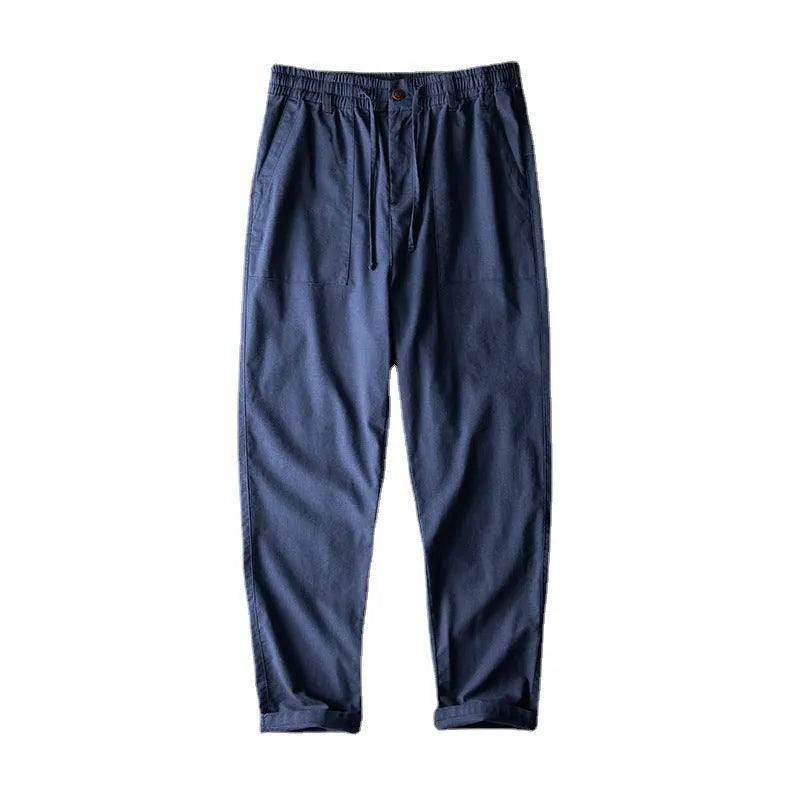 Men's solid colour linen trousers in mid-waist design available in three colours