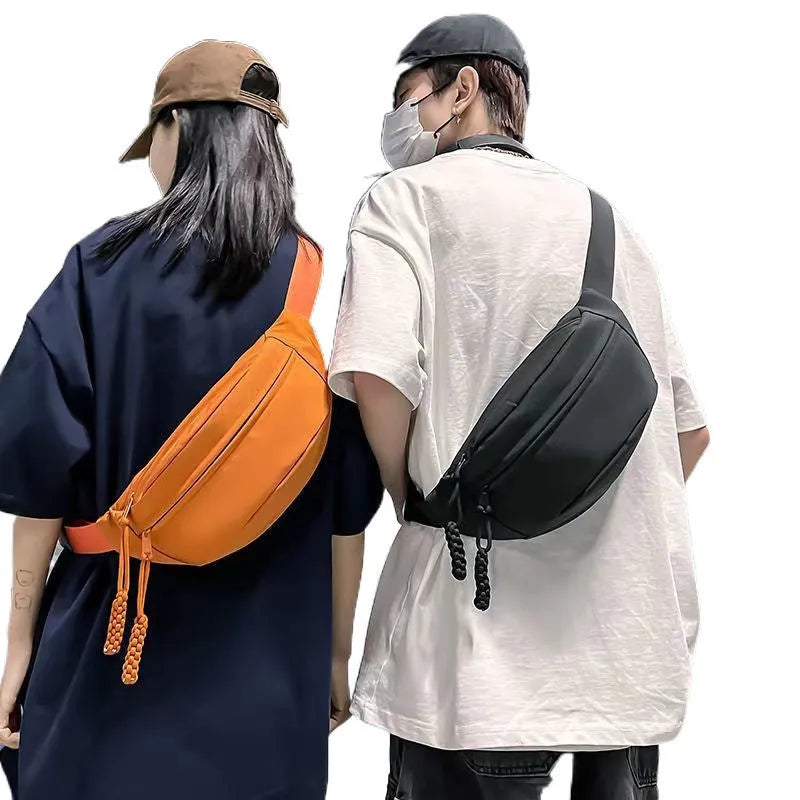 Men's small black polyester crossbody chest bag with adjustable strap.