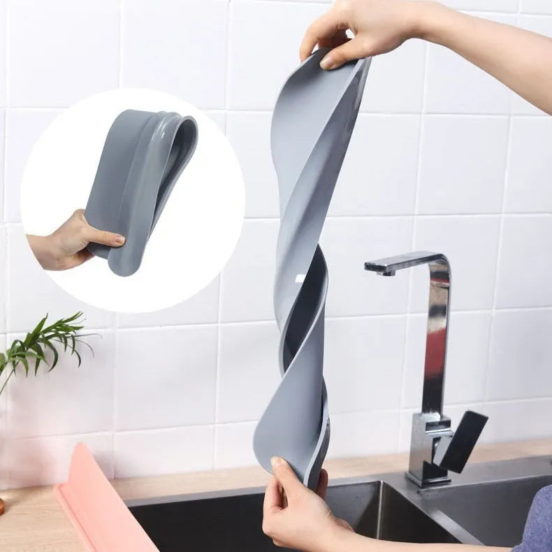 Grey-blue silicone kitchen sink water blocking plate measuring 52mm by 85mm
