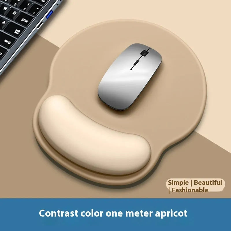 Silicone mouse mat with integrated wrist rest in a gradient blue black colour on a desk.