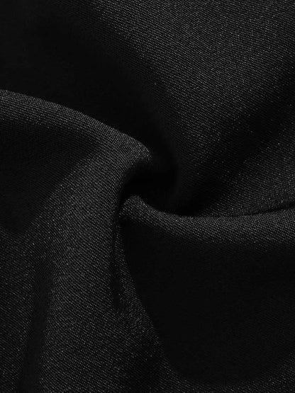 A pair of black loose-fit semi-elastic shorts with a colour button and zipper fly.