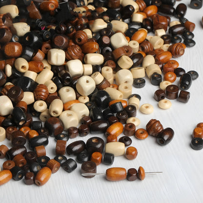Mixed colour vintage solid wood beads scattered for DIY jewellery making and ethnic style craft projects