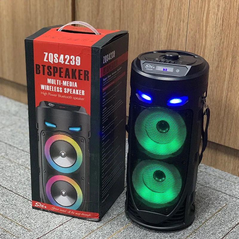 Black portable Bluetooth speaker with dual horn cannon design and wheat-coloured elements