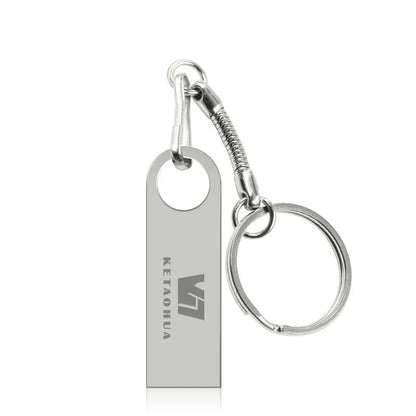 Custom silver metal car-shaped USB flash drive on a white background