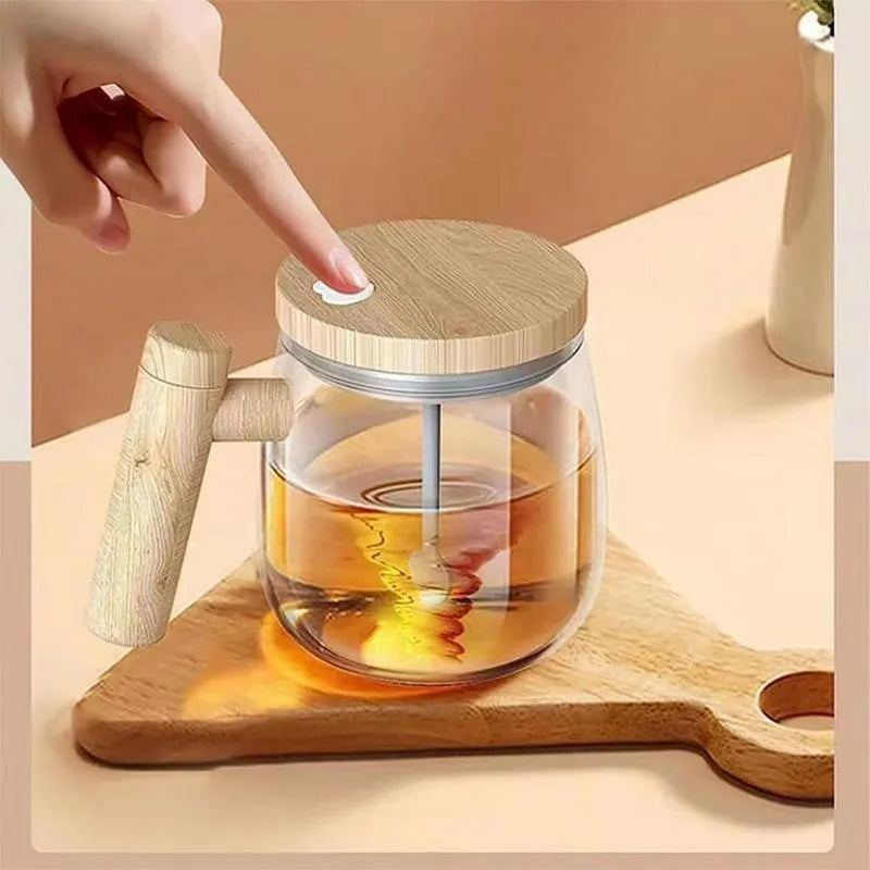Clear borosilicate glass electric self-stirring coffee mug with 400ml capacity.