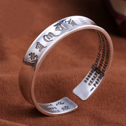 Silver-plated bracelet with engraved inspirational words, vintage-inspired design, elegant and sophisticated accessory