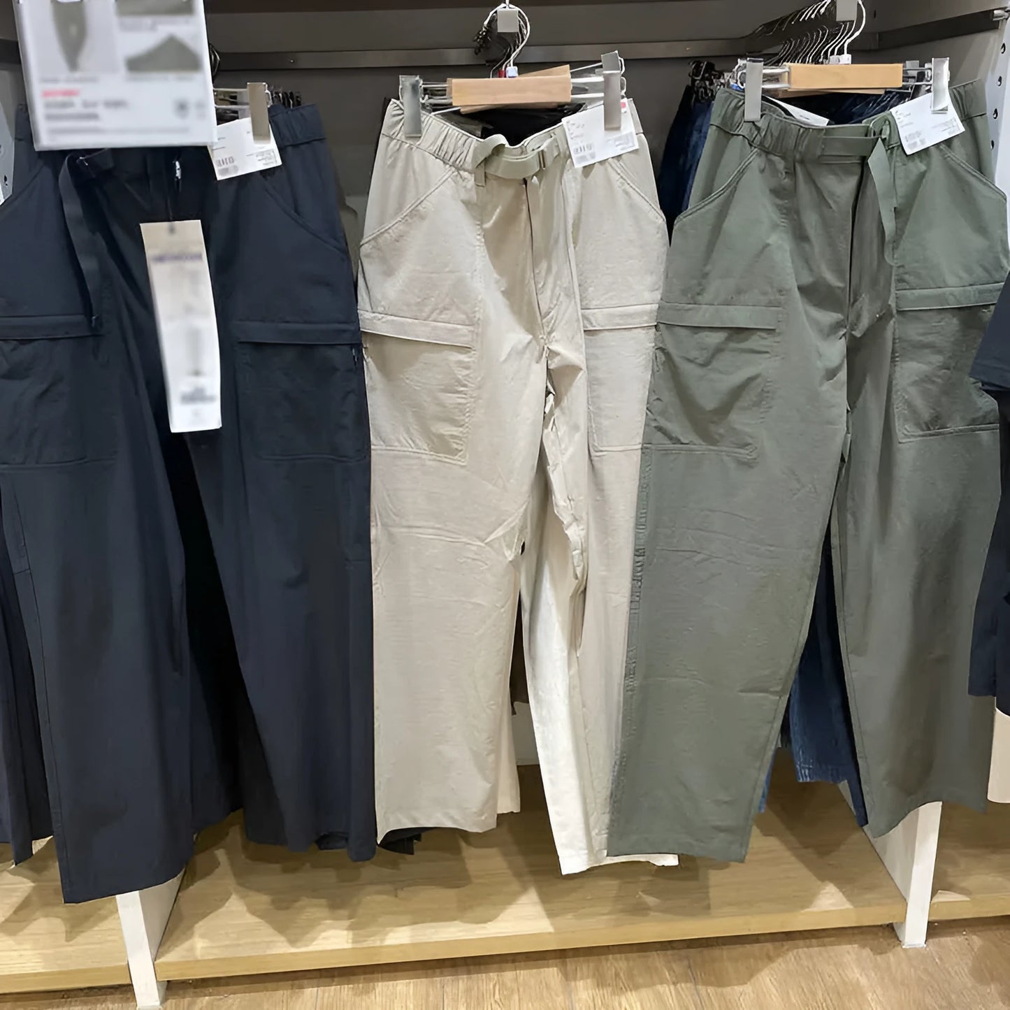 Men's straight leg work trousers in bamboo fibre fabric with micro elasticity stretch available in black, olive, and beige colours.