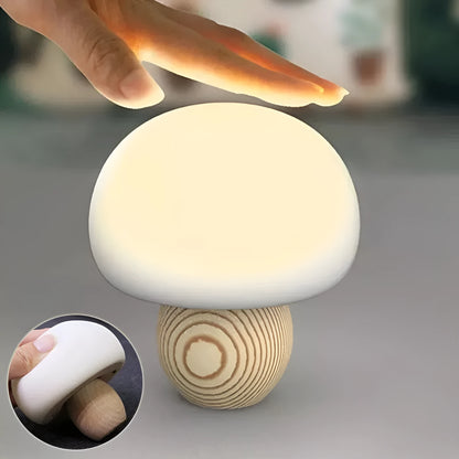 White silicone mushroom-shaped LED night light with a wooden base and touch control.