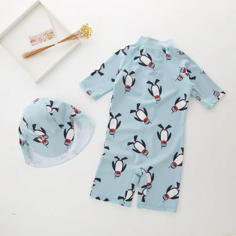Boy's penguin-print long sleeve swimsuit with matching swimming cap for sun protection