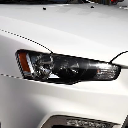 Transparent plastic car headlight housing cover with dimensions 50mm by 30mm by 20mm.